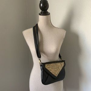 Black folder over clutch bag with strap